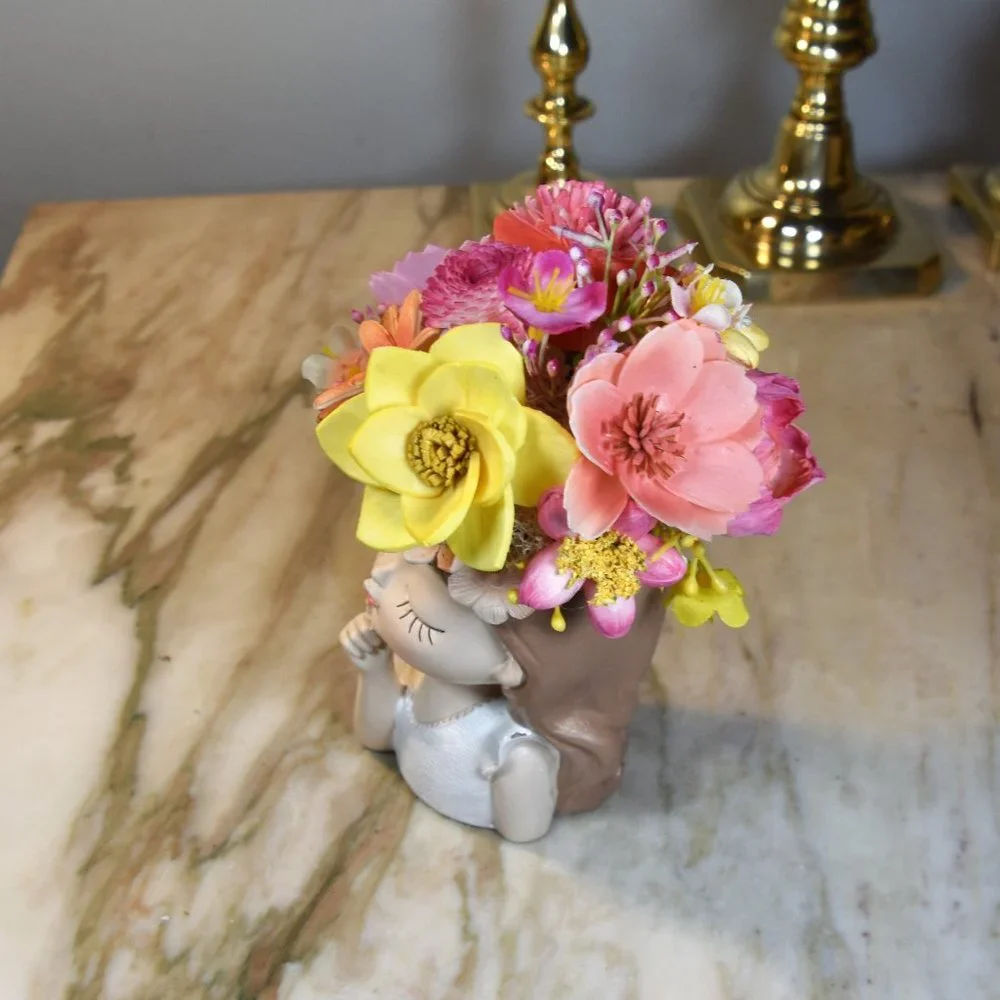 Planter with bright flowers you never water! Molded resin girl-adorable details